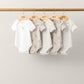 5-pack baby giraffe bodysuits: white, striped, and light gray with giraffe prints