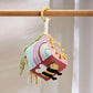 Soft fabric activity cube toy with hanging loop and multicolor sensory panel