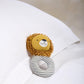 Lion plush grabber activity toy with striped ring body and smiling mane