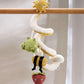 Travel spiral activity toy with sun, moon, frog, bee, and strawberry plush figures