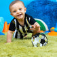 Black and white soccer rattle ball with colorful rattle window on play floor