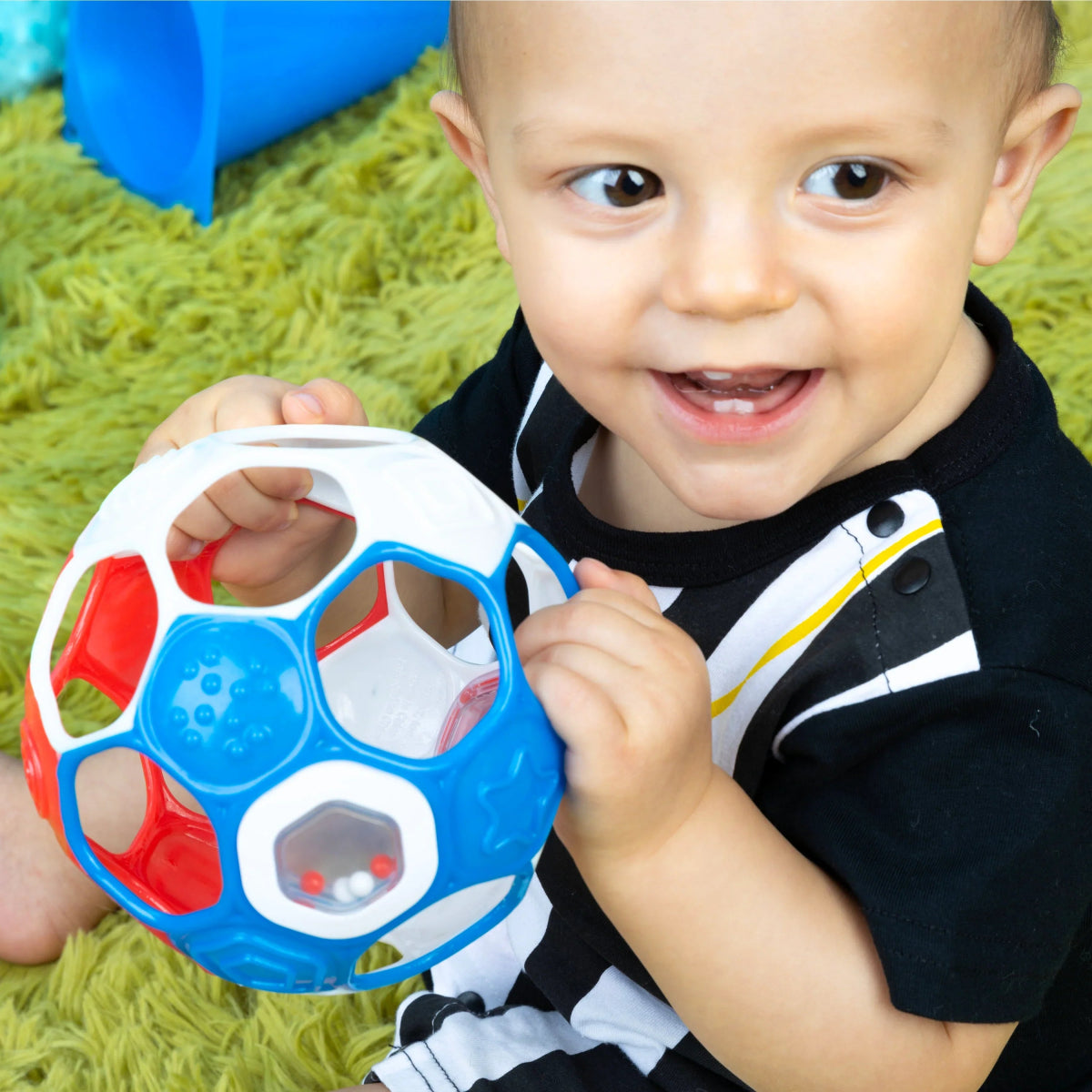 Close-up red, white, and blue rattle soccer ball with light-up panel