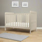 Cotbed in light grey with slatted guardrail and rectangular panel headboard and footboard