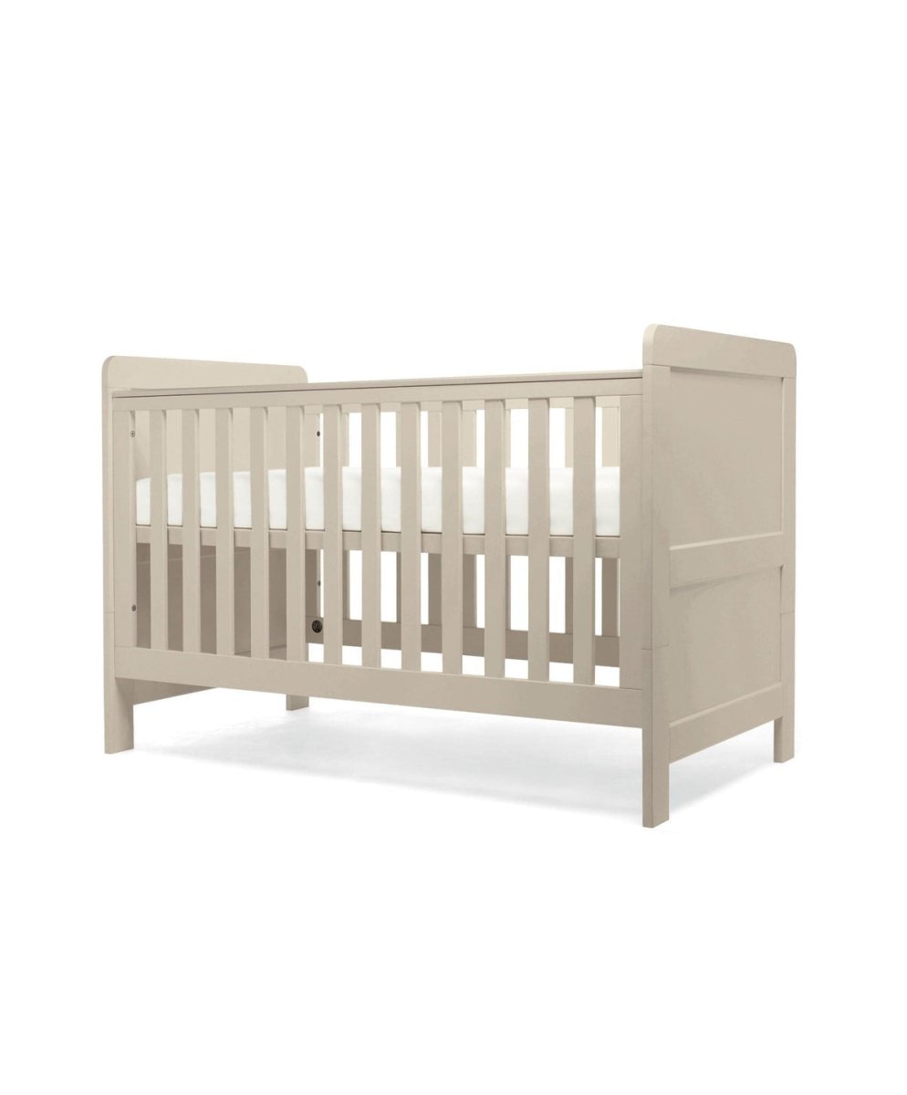 Cotbed in light grey with corner posts and vertical slatted side guard rail