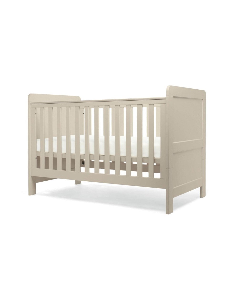 Cotbed in light grey with vertical slatted sides and panel headboard and footboard