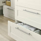 Dresser changer with open top drawer showing changing insert and metal bar pulls