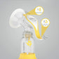 medela Harmony manual breast pump in white and yellow with flange and bottle