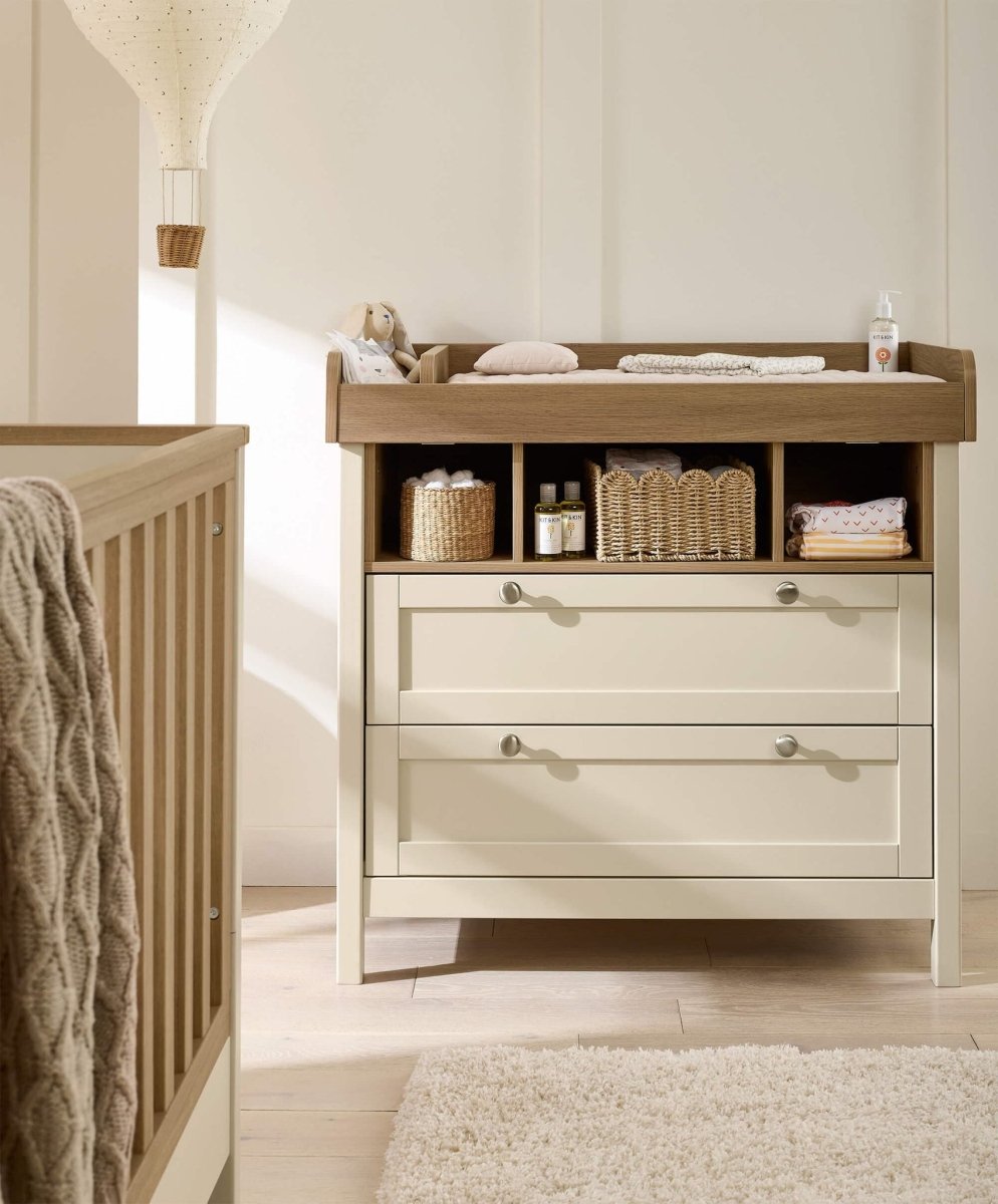 Baby dresser changer with changing rail and open shelves, baskets and two drawers