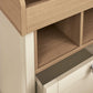 Baby dresser changer close-up of wood changing rail and open shelf below
