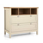 Baby changing dresser front view with light cream drawers and open storage cubbies