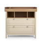 Baby dresser changer front view with three open cubbies, white drawers, wood top