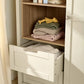 Wardrobe cabinet interior with stacked folded cashmere sweaters on shelves and drawer bin