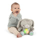 Grey plush bunny soothing toy with glowing belly lights, held by a baby