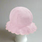 Pink reversible bucket hat with scalloped brim