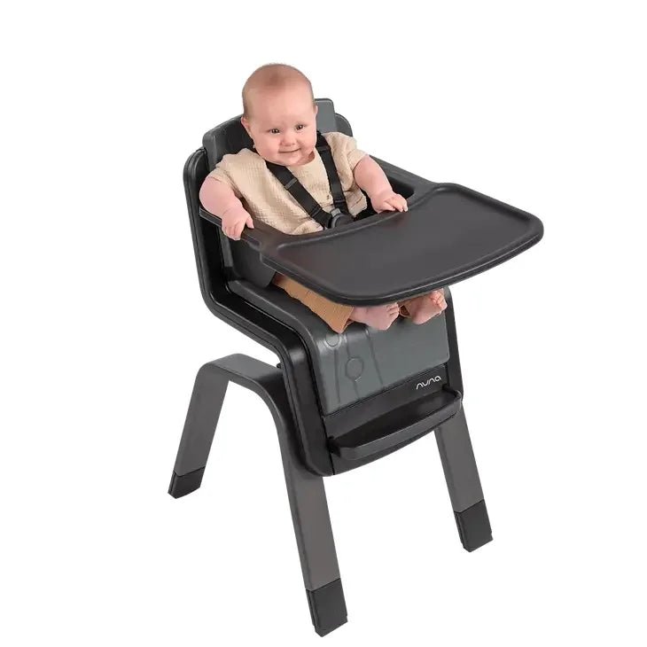 High chair with black tray, gray seat pad, and five-point toddler harness