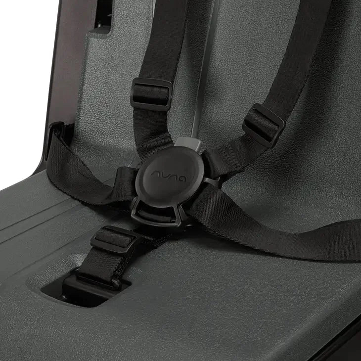 High chair seat with buckle harness and fabric straps on a textured gray cushion