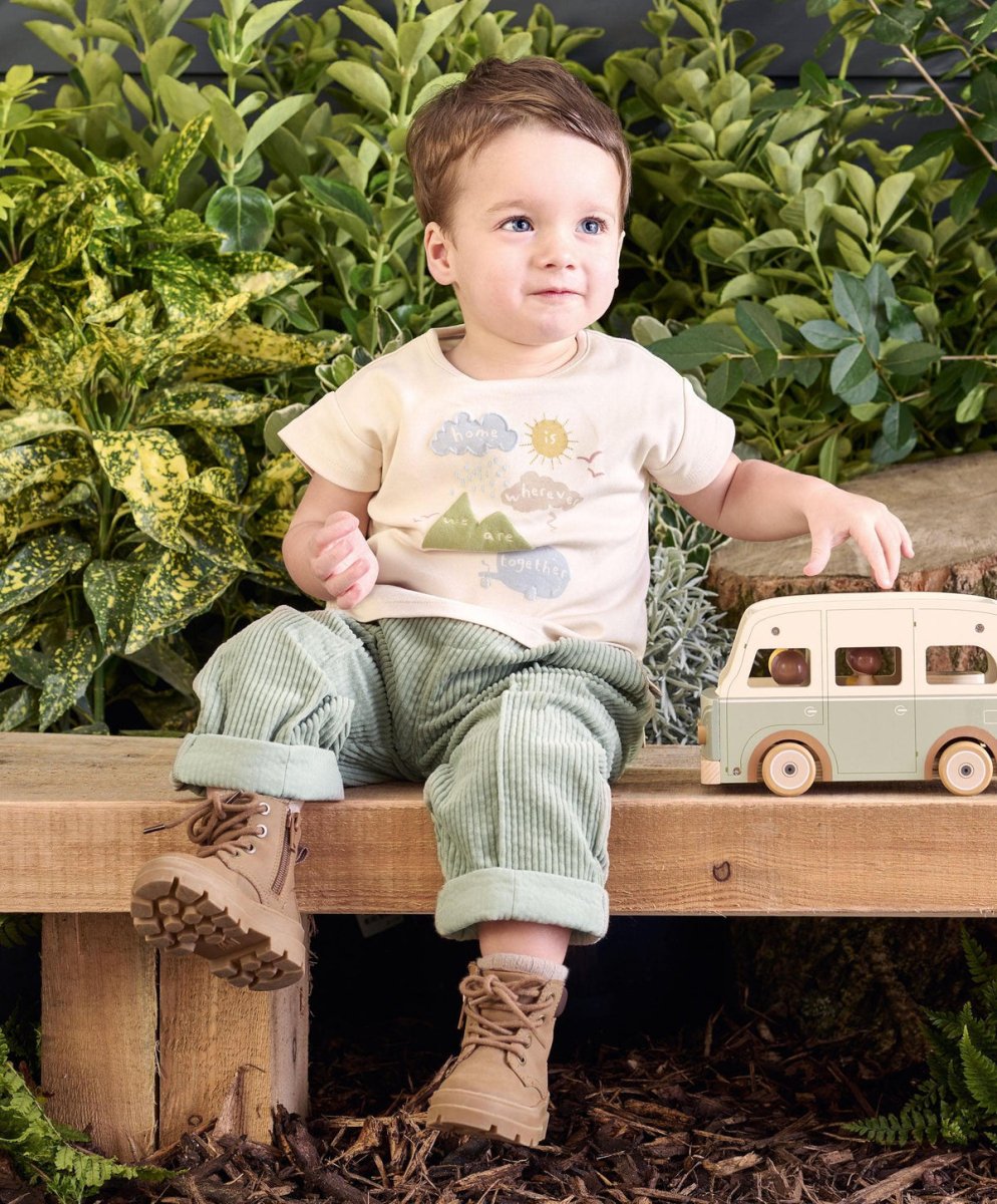 Cream baby T-shirt with playful sun, cloud, and mountain print