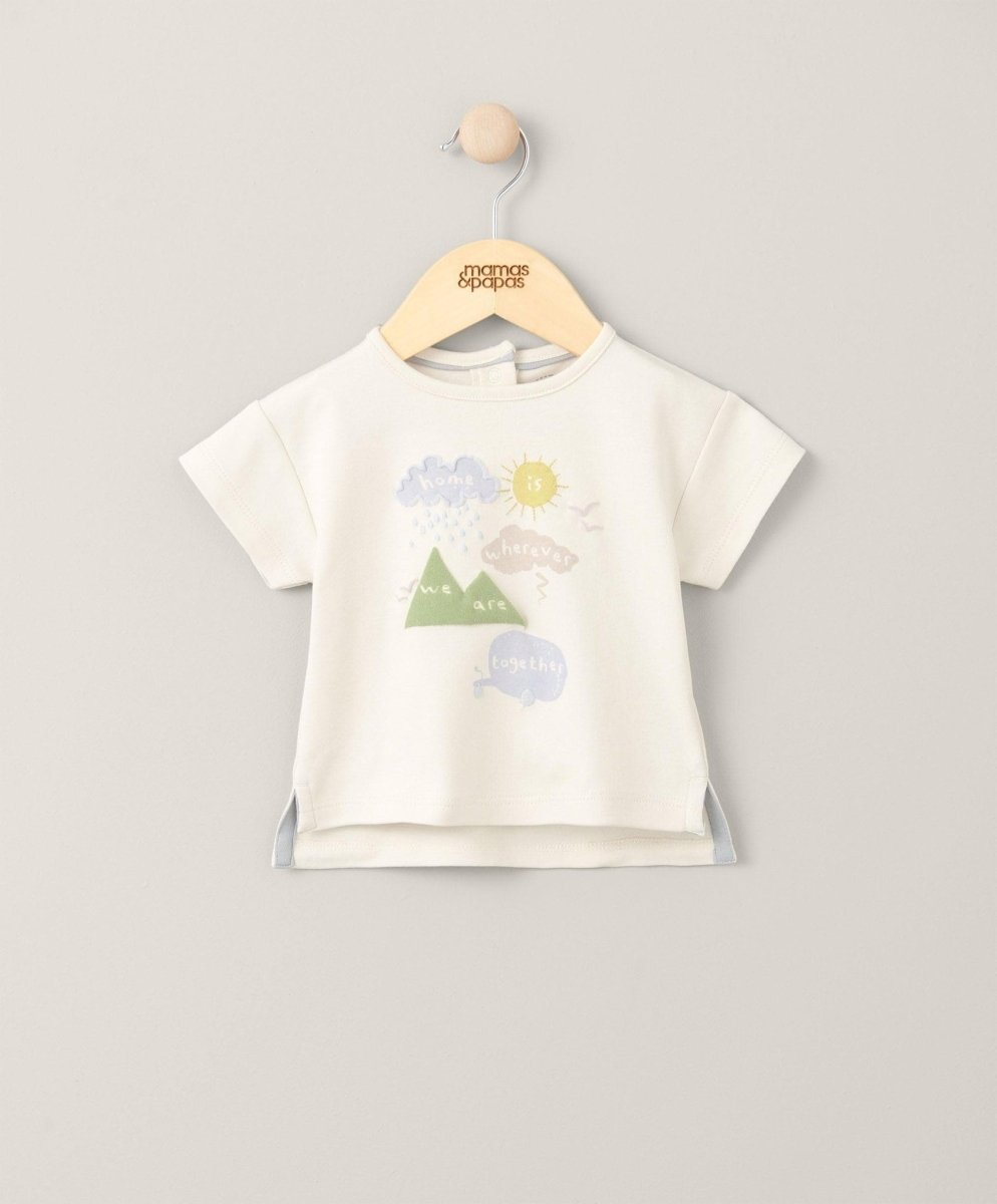 Cream short-sleeve T-shirt with front graphic of sun, clouds, and mountains