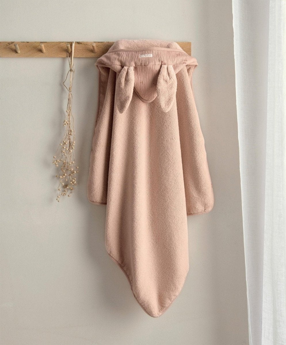 Hooded towel in dusty rose with attached hood and soft draped body