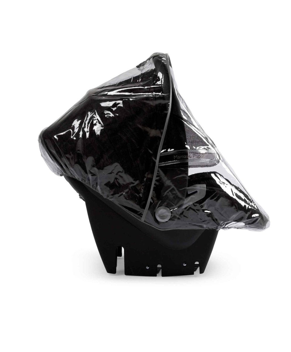 Infant carrier raincover, glossy black with transparent window and snap closure.