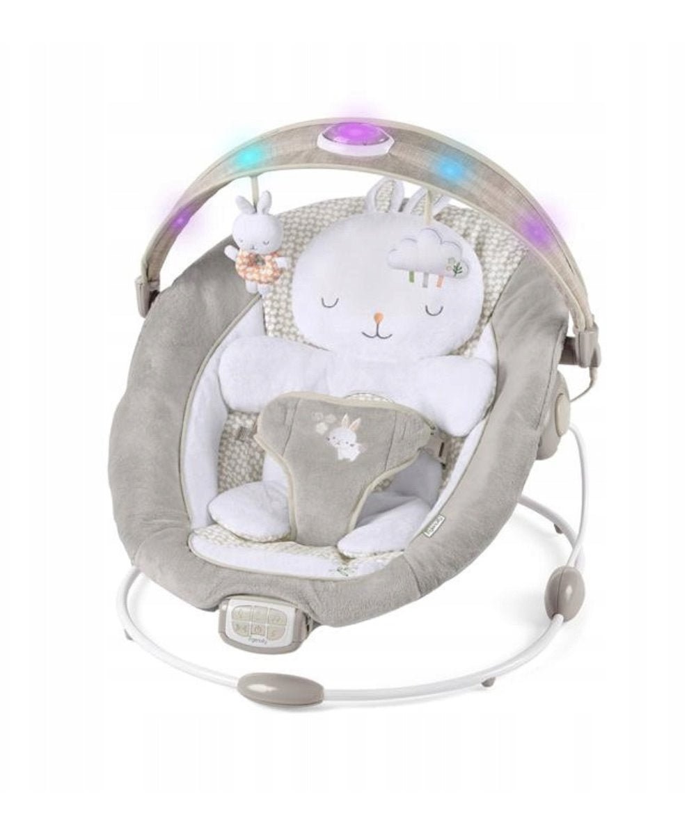 Infant bouncer with grey seat, bunny plush toys, and oval baby insert