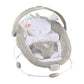Infant bouncer with grey seat, white bunny head cushion, and toy arch