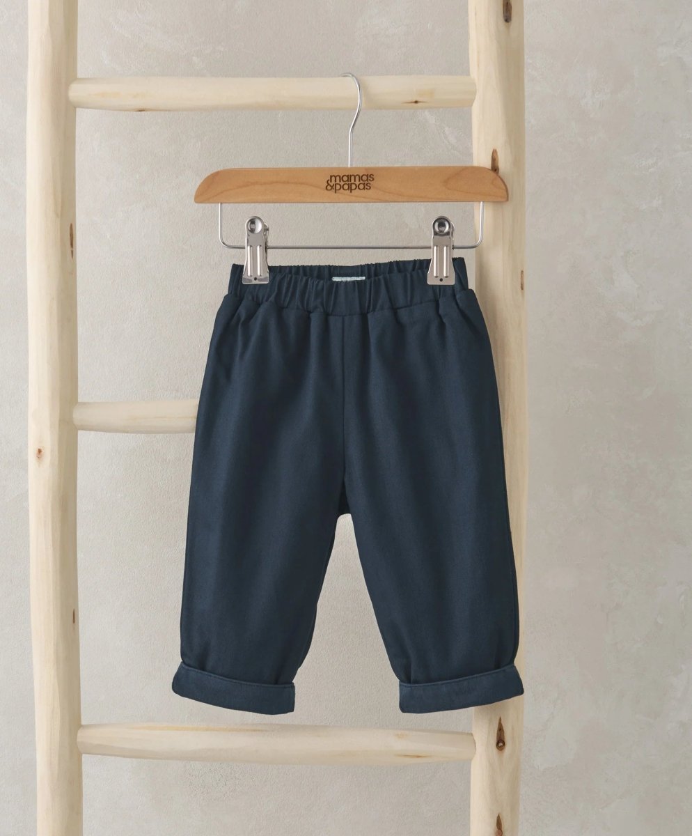 Jersey lined trousers, dark navy with elastic waistband and cuffed hem, hanging view