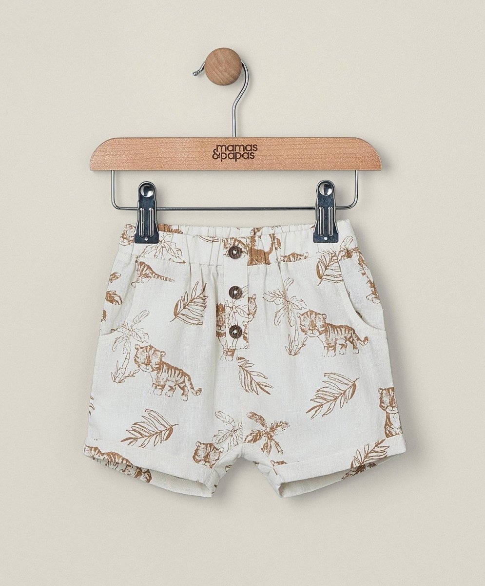 Linen shorts in light color with jungle animal and leaf print, button front