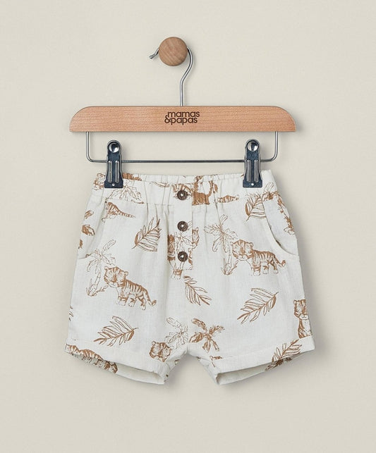 Linen shorts in light color with jungle animal and leaf print, button front