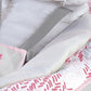 Baby bouncer seat pad with gray harness strap and white cover with red patterned trim