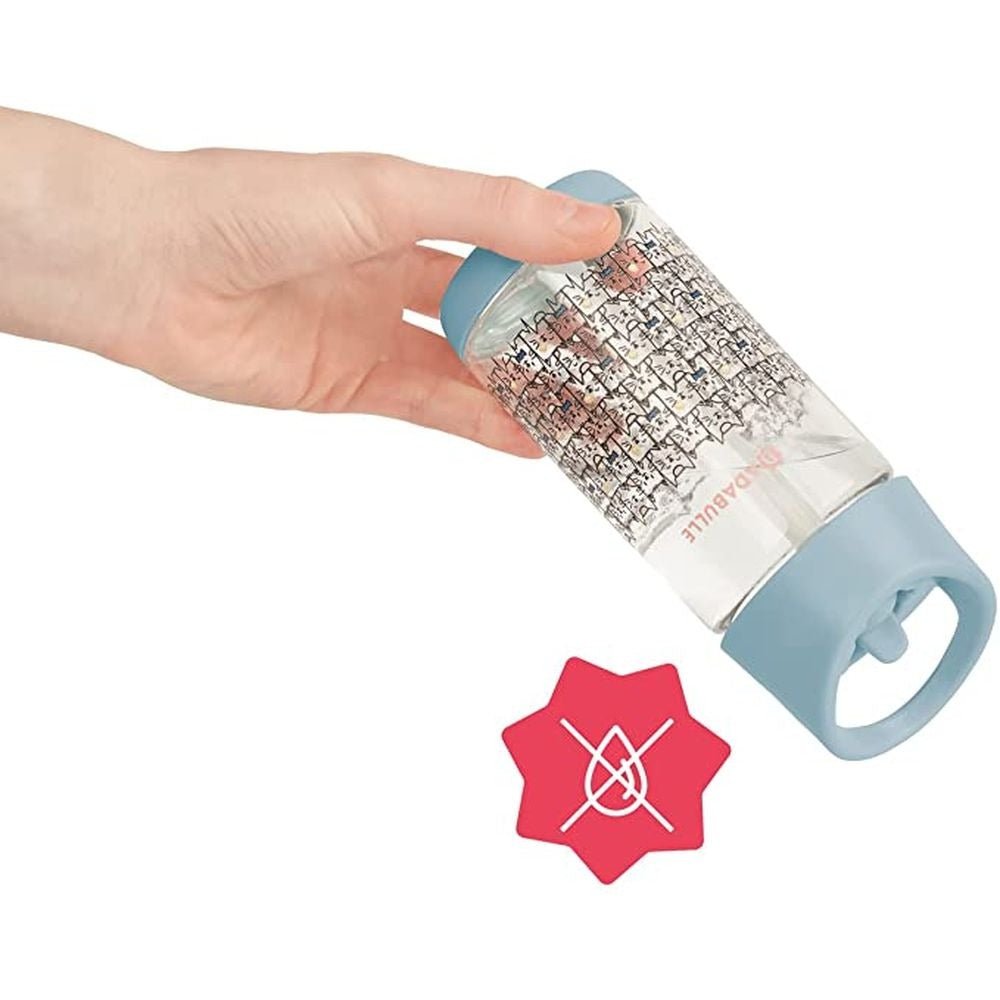 Kids straw water bottle held in hand, light blue lid and clear cat-pattern body