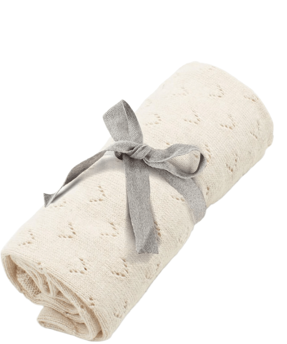 Oat knitted pointelle blanket, rolled with gray bow tie
