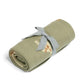 Rolled sage green knitted blanket with safari animals, tied with gray fabric bow