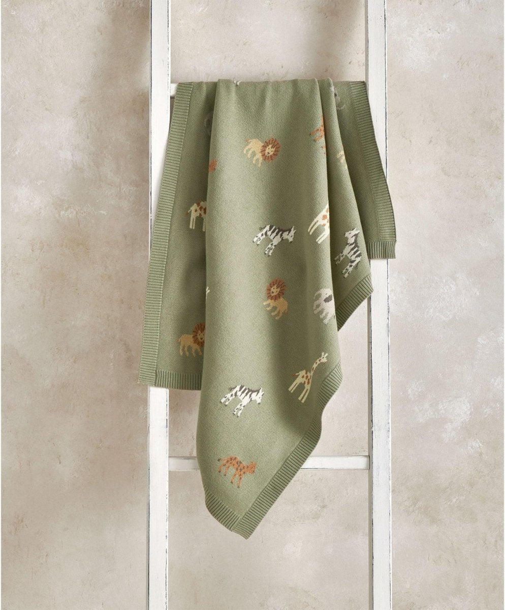 Sage green knitted blanket with safari animal print and ribbed border