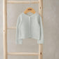 Grey knitted cardigan with button front, long sleeves, ribbed trim