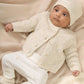 White knitted cardigan on child, button front and stand collar