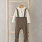 Cream long-sleeve bodysuit with teddy applique and brown knitted dungarees, front