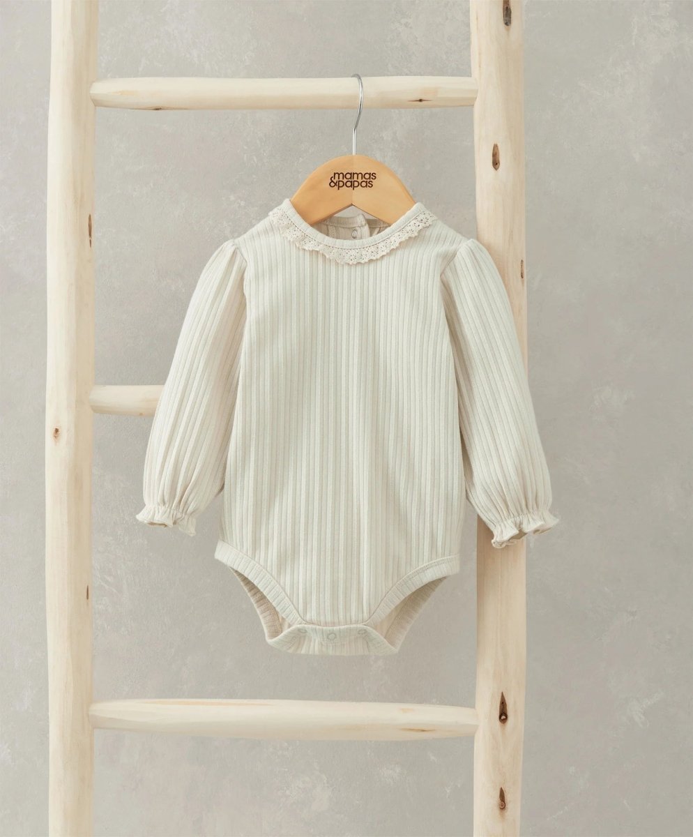 Cream lace-trim long-sleeve bodysuit with ruffled neckline