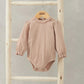 Pink lace-trim bodysuit with puff sleeves and ruffled collar