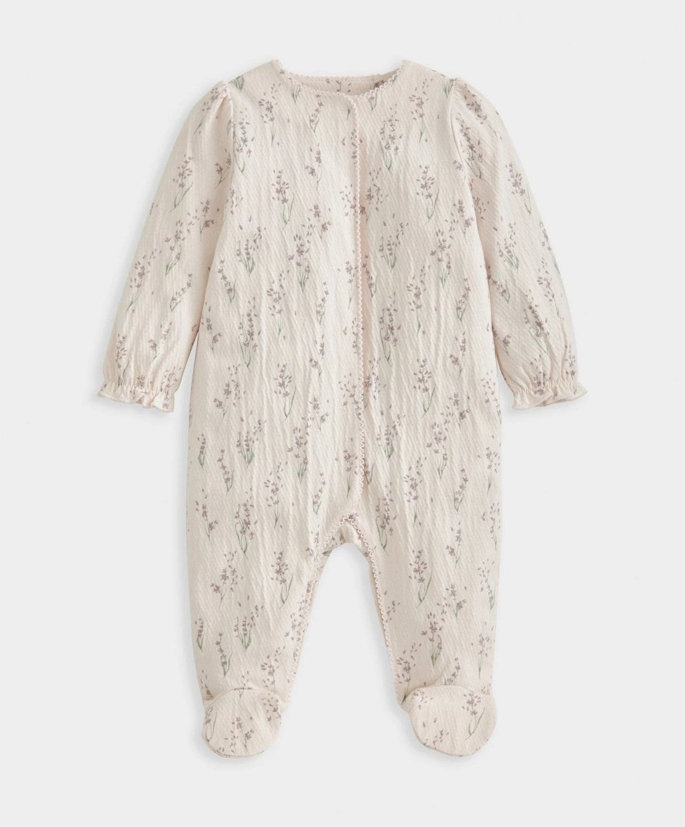 Cream floral long sleeve footed baby onesie