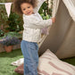 Light blue denim jeans on toddler, embroidered details on legs, elastic waist