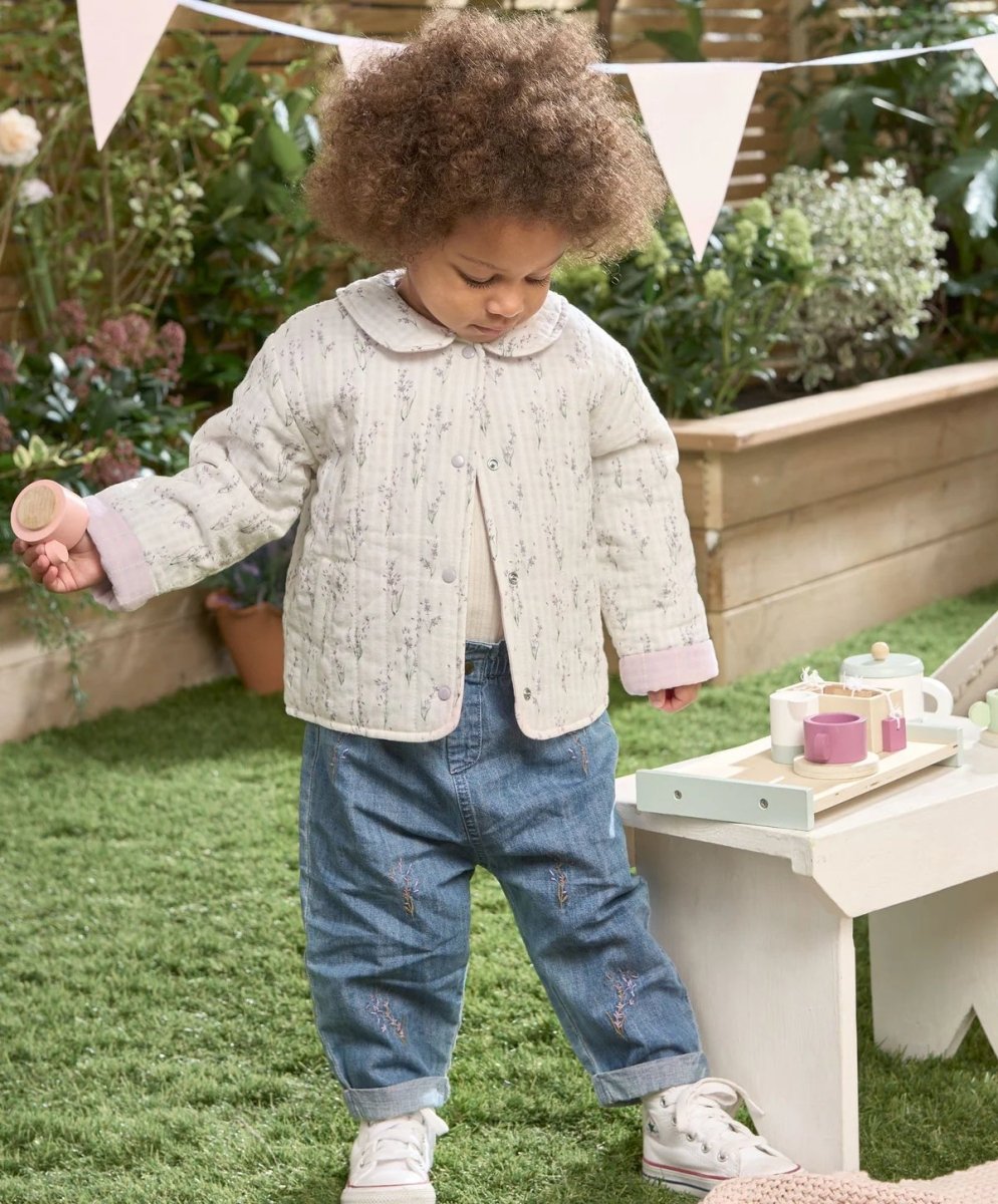 Light blue denim jeans with embroidered motifs at thighs, relaxed toddler fit