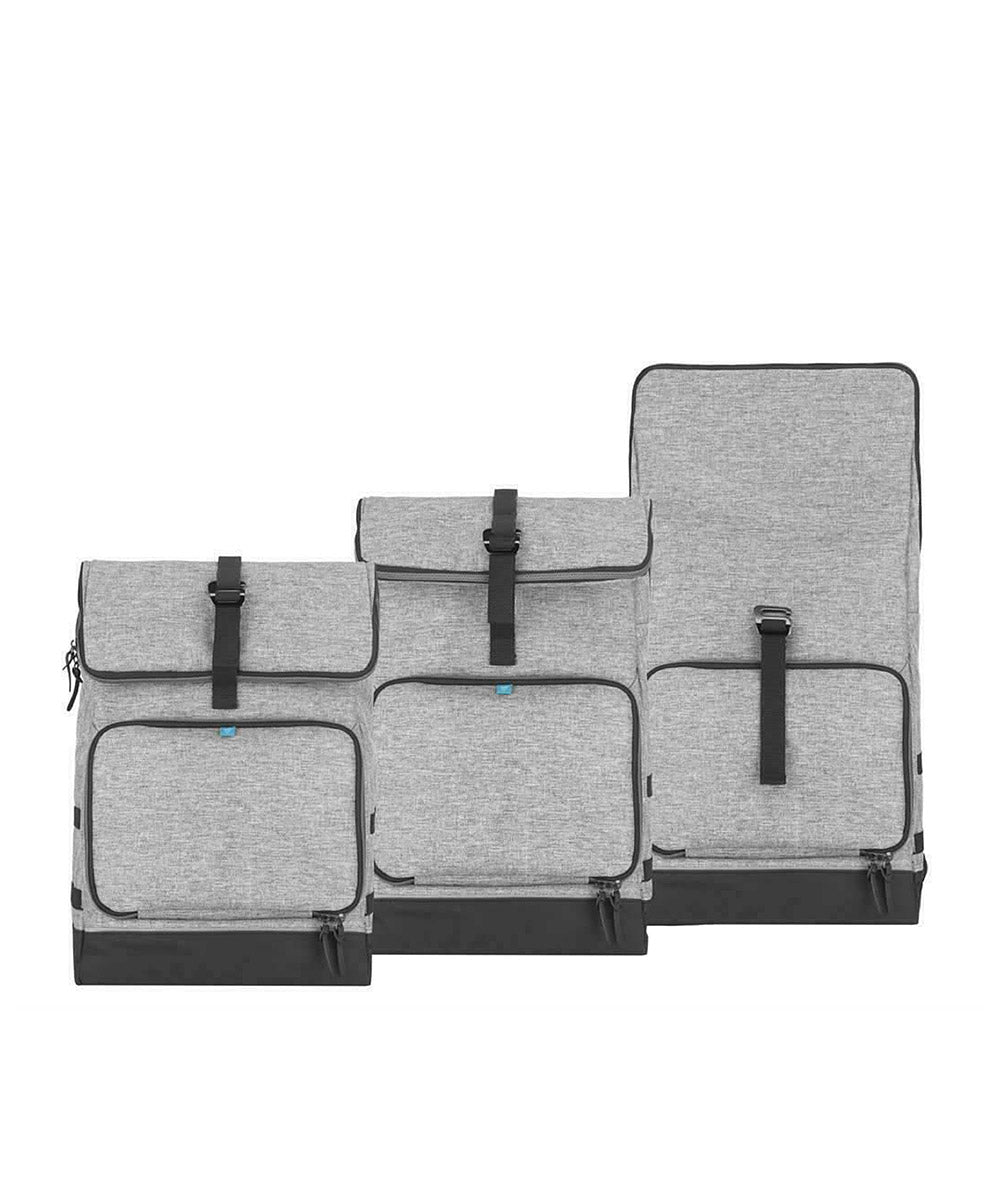 Grey changing bag backpack laid open, showing multiple compartments and straps.