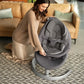 Gray baby rocker with padded seat and headrest on curved base