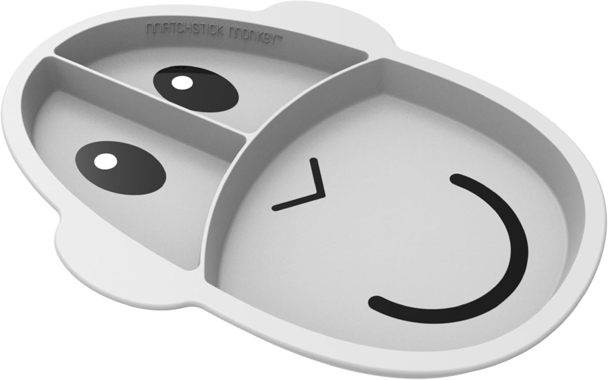 Light grey silicone divided learning plate with animal face; two compartments.