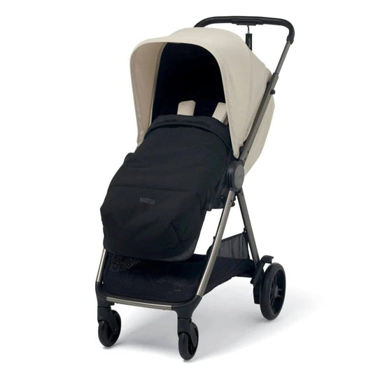 Beige stroller with black seat cover and canopy, front view
