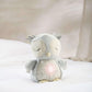 Light gray plush owl sensory toy lying down with eyes closed and beak