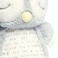 Light gray plush owl with cream nose and embroidered belly text panel