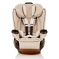 Champagne all-in-one car seat with quilted padding, harness buckle, and cup holders.