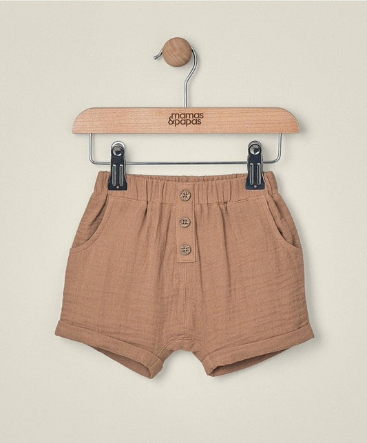 Brown linen shorts with elastic waistband and button-front detail